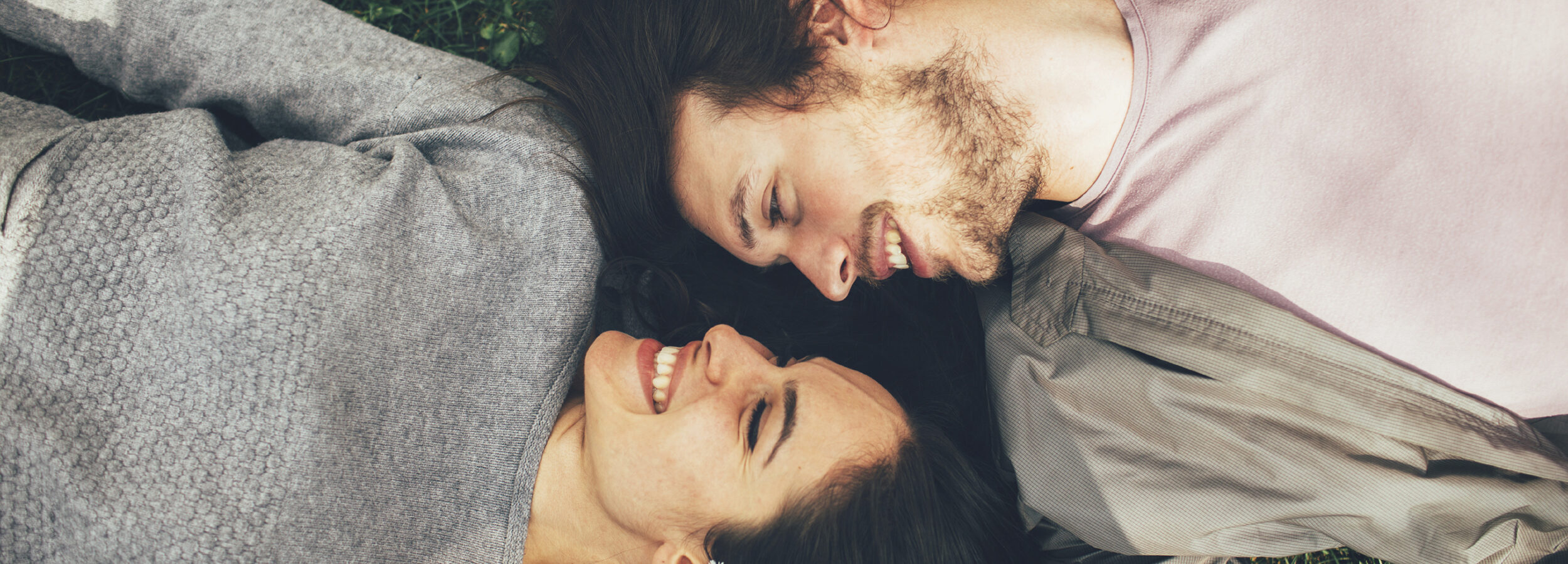 Turn towards. Image of couple looking at one another fondly.