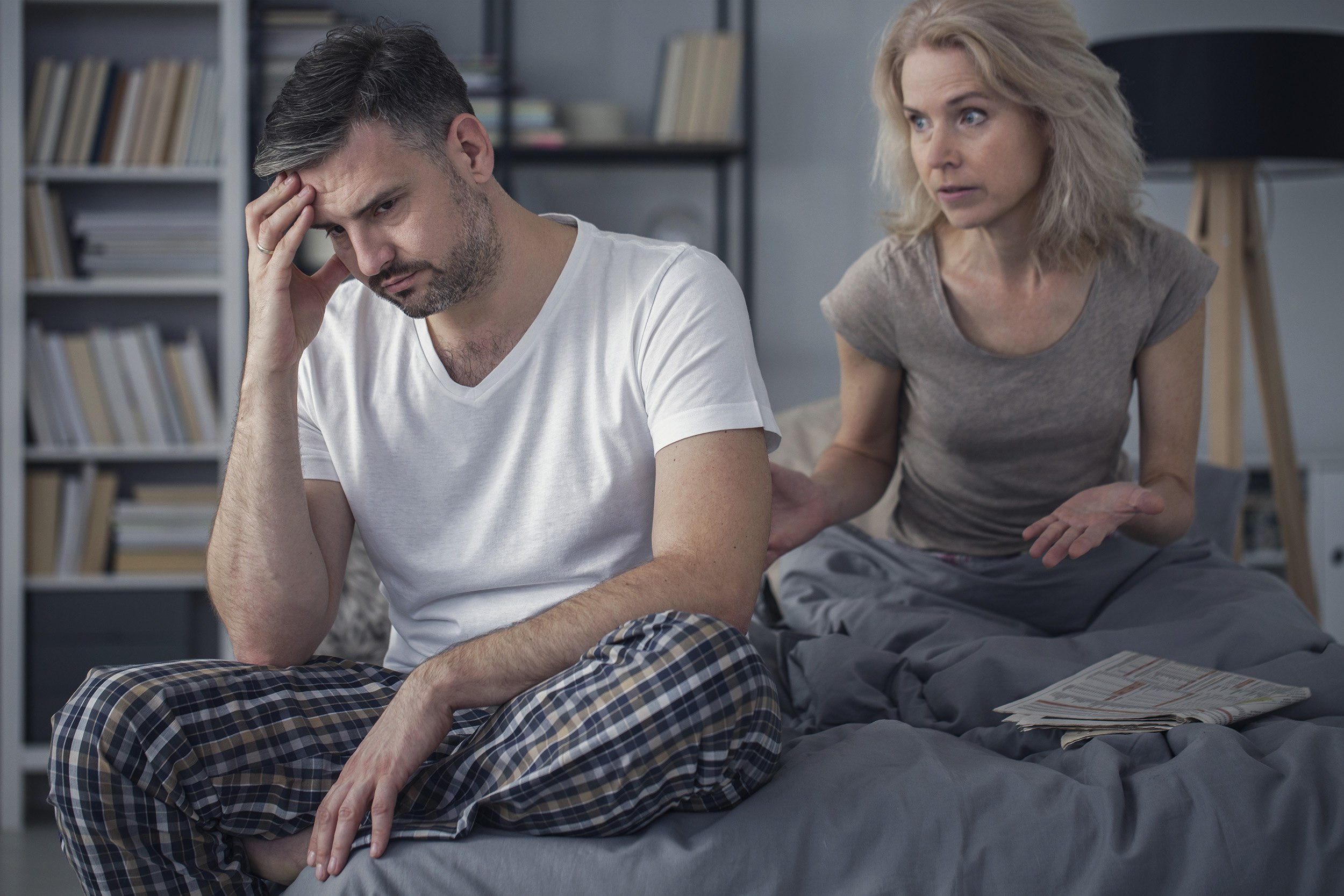 Married couple arguing in bedroom