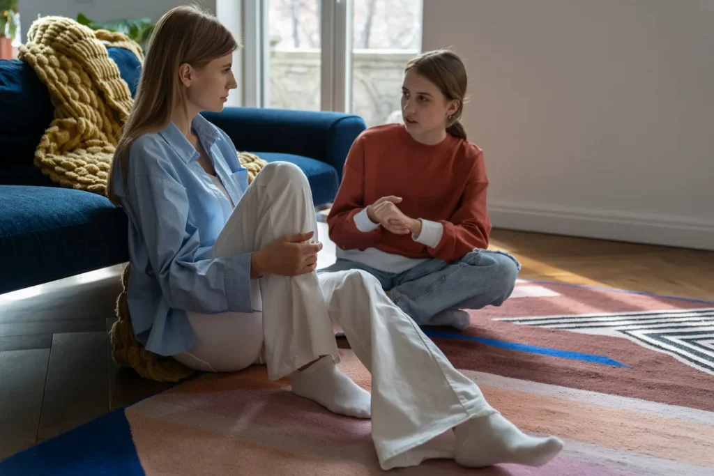 Mom talking to her teenage daughter about school and life.