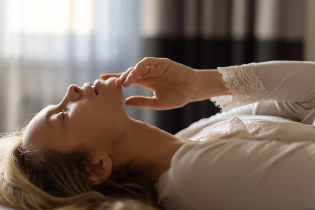 A woman finding pleasure by herself.