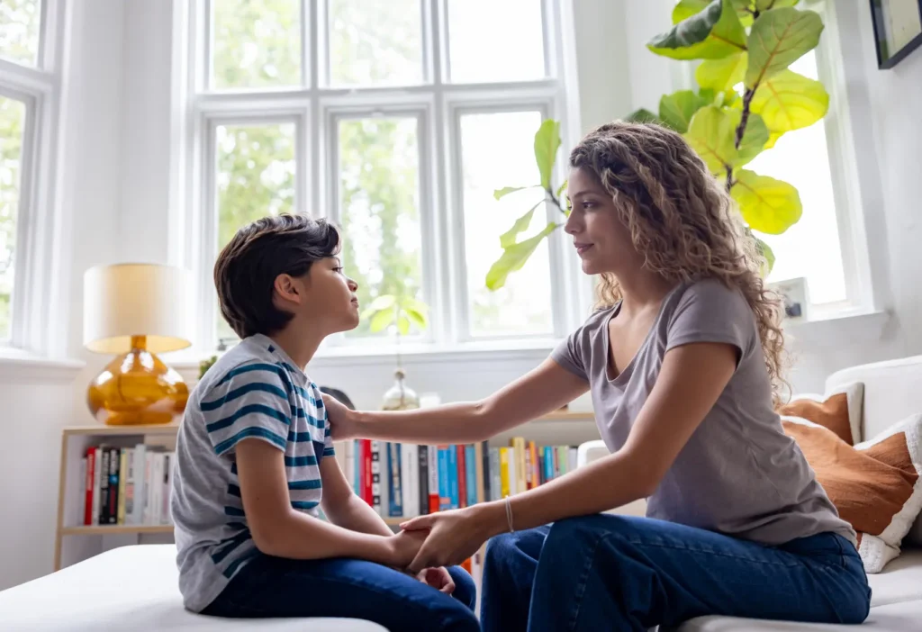 Parent helping child through a difficult situation.