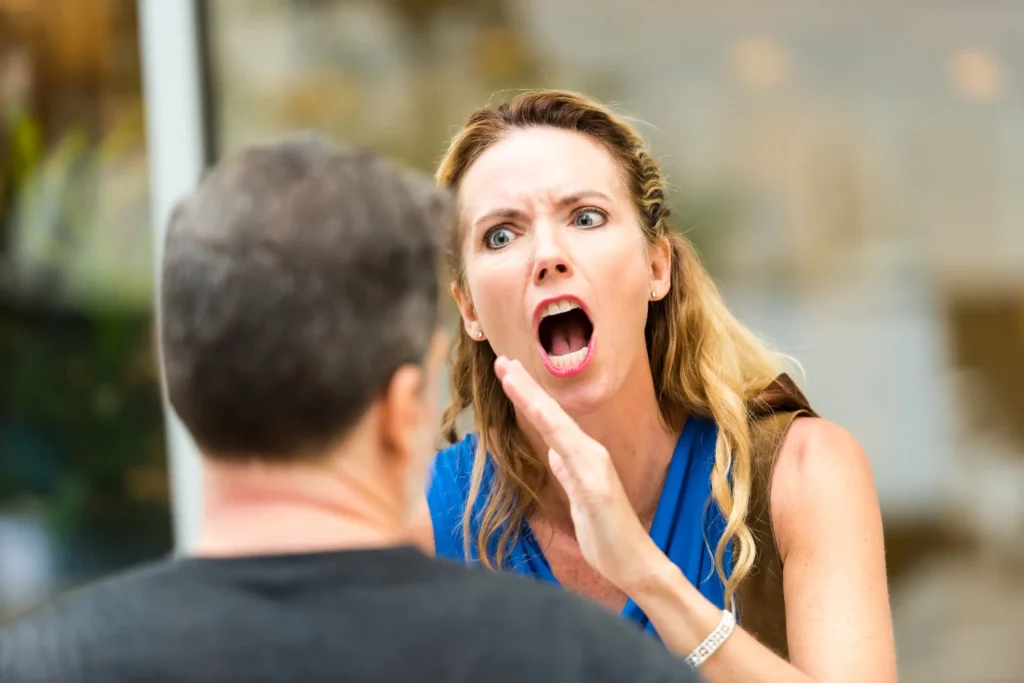 Wife losing her temper with her husband in a case of reactive abuse.
