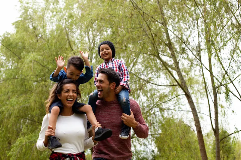 A family enjoying the outdoors together during the summer.