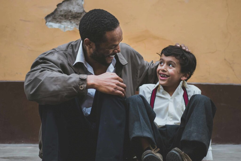 a present father emotion coaching his young son, building a close father-son relationship